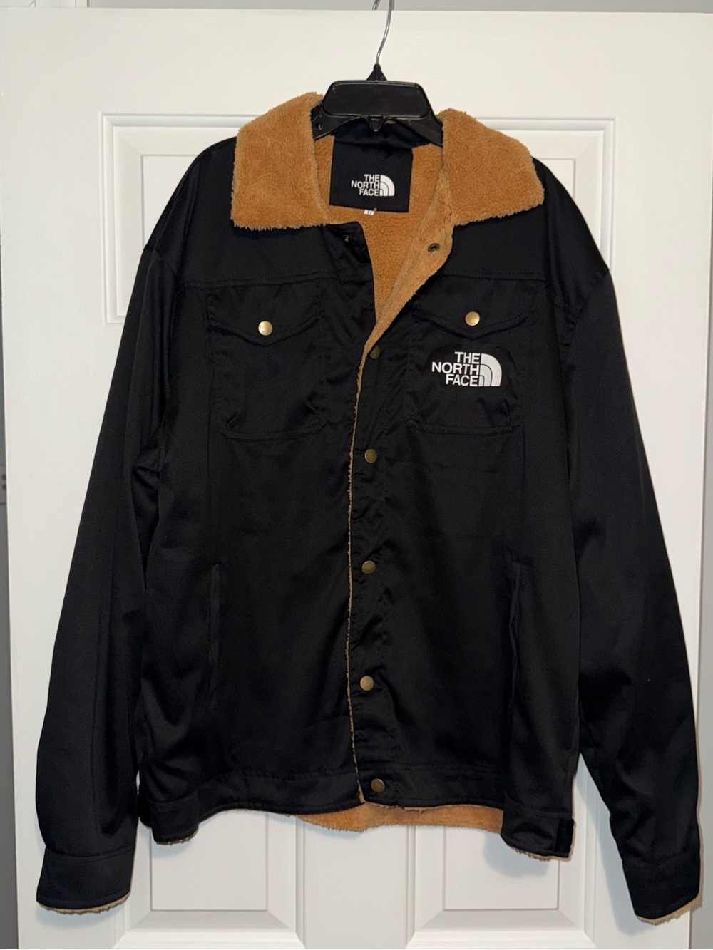 The North Face Black Jacket with Tan Sherpa Lining